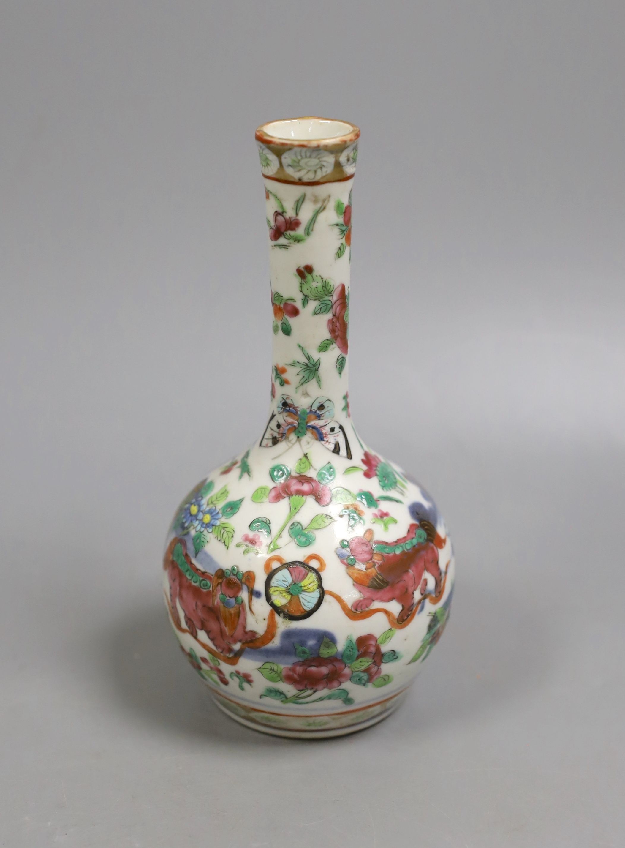 A 19th century Chinese famille rose bottle vase (dogs of fo), 17 cms high.